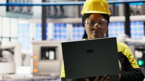 Smart factory engineer using laptop to implement automated workflows Stock Footage 308708093