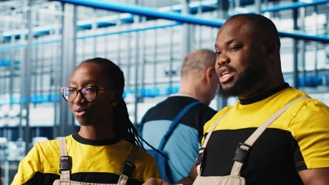 Smart factory engineering team brainstorming, testing automated systems Stock Footage 305498743