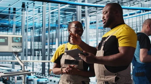 Smart factory engineering team brainstorming, testing automated systems Stock Footage 305507294