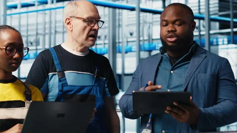 Smart factory engineering team colleagues implement automated workflows Stock Footage 305501324