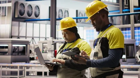Smart factory engineering team implement automated workflows Stock Footage 307452405