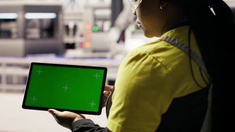 Smart factory specialist using green screen tablet to test automated systems Stock Footage 307362145
