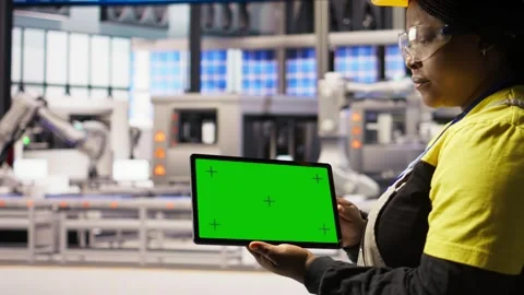 Smart factory specialist using green screen tablet to test automated systems Stock Footage 308725861