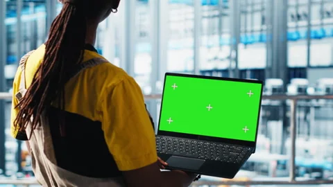 Smart factory specialist using mockup laptop to test automated systems Stock Footage 305483621