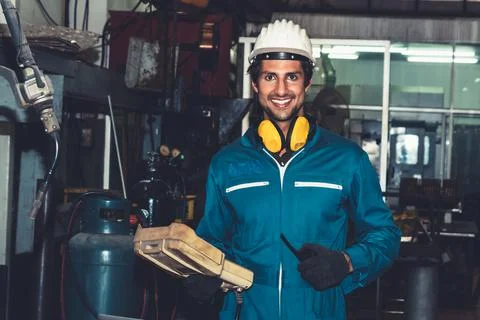 Smart factory worker or engineer do machine job in manufacturing workshop Stock Photos