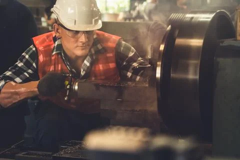 Smart factory worker or engineer do machine job in a manufacturing workshop Stock Photos