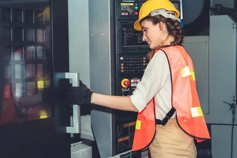 Smart factory worker or engineer do machine job in the manufacturing workshop Foto stock