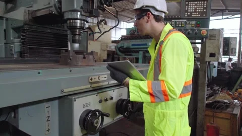 Smart factory worker using machine in factory workshop Stock Footage 139972224