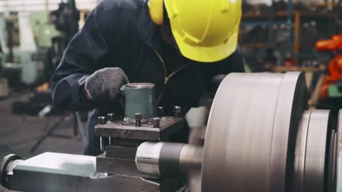Smart factory worker using machine in factory workshop Stock Footage 142294751