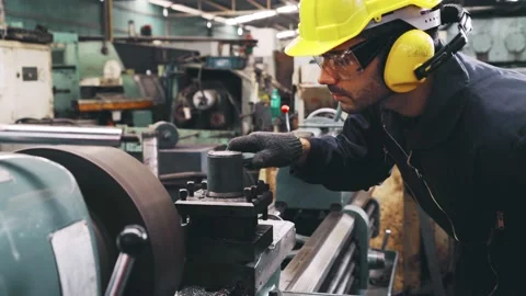 Smart factory worker using machine in factory workshop Stock Footage 142296193
