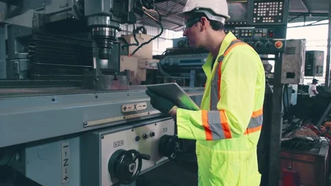 Smart factory worker using machine in factory workshop Stock Footage 142300137