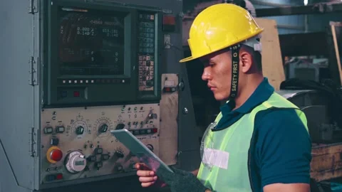 Smart factory worker using machine in factory workshop Stock Footage 142300915