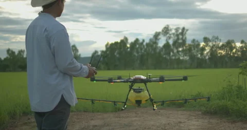 Smart farmer using drone controller or drone transmitter a remote control f.. Stock Footage 325804741