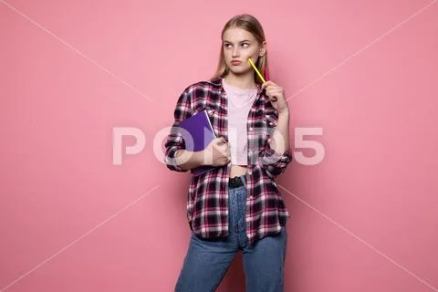 Smart female student with blonde hair wearing casual clothing Stock Photos