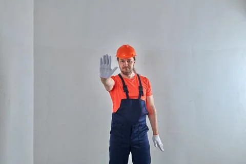 Smart foreman makes an important hand gesture Stock Photos