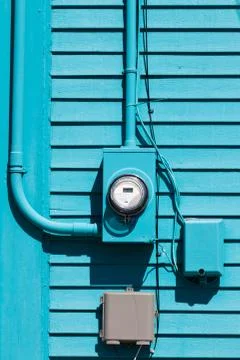 Smart grid electric meter connection on blue wall Foto stock