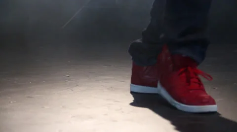 Smart guy, is performing a stylish dance in front of the camera by moving a leg Stockbeeldmateriaal 22843047