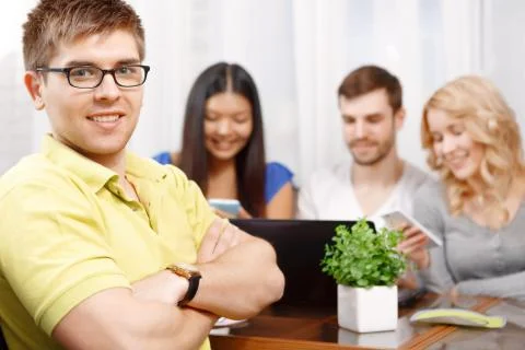 Smart handsome app developer with his team 写真素材