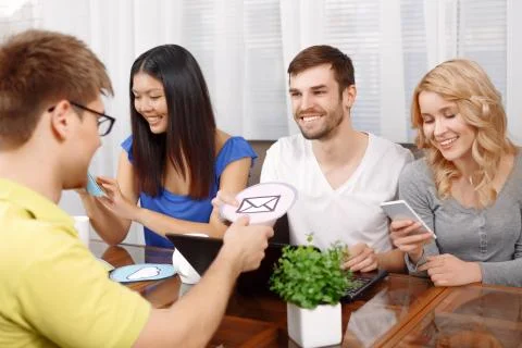 Smart handsome app developer with his team 写真素材