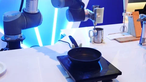 Smart handy chef robot preparing omelet beating eggs in bowl robotic assistant Stock Footage 121076179