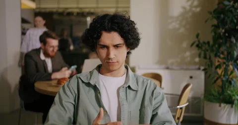 Smart Hispanic Man Looking At Screen Of Laptop And Thinking About New Business Stock Footage 276869950