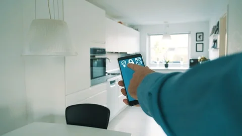 Smart home app on mobile phone wirelessly controls light bulbs in lamps Stock Footage 101828627