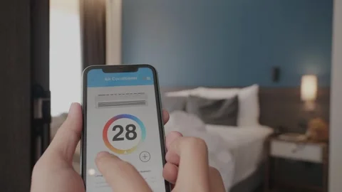 Smart Home Control: Adjusting Air Conditioning via Smartphone Stock Footage 314570450