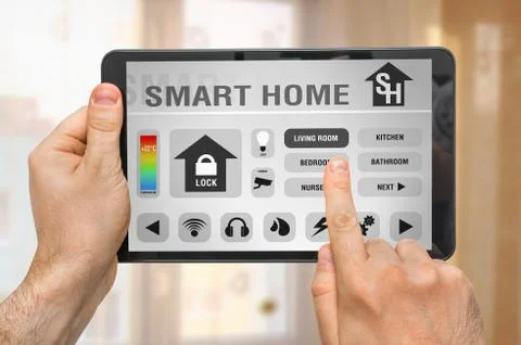 Smart home control app on tablet with unfocused home interior in background Stock Photos