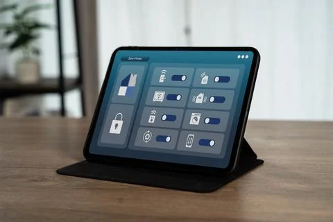 Smart home control panel on tablet with home automation interface, IoT tech.. Stock Photos
