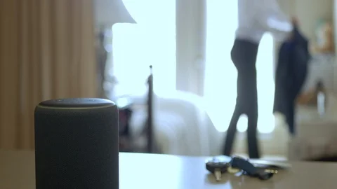 Smart Home Device, Man Getting Ready For Work In The Background. Stock Footage 101048217