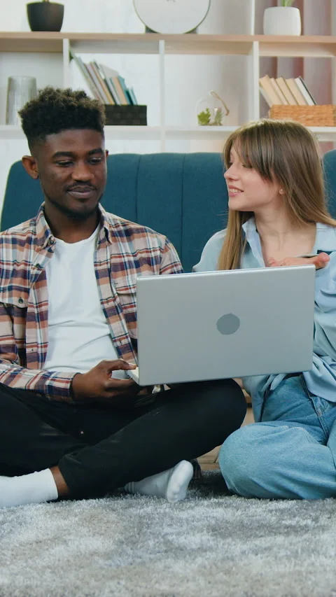 Smart home function concept where attractive satisfied multiracial guy and girl  스톡 동영상 329185262