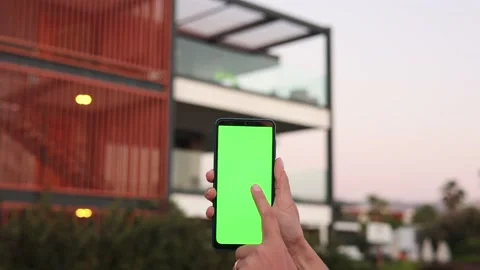 Smart home, smart house, application on the mobile phone. Hand holds smartphone Stock Footage 181495633
