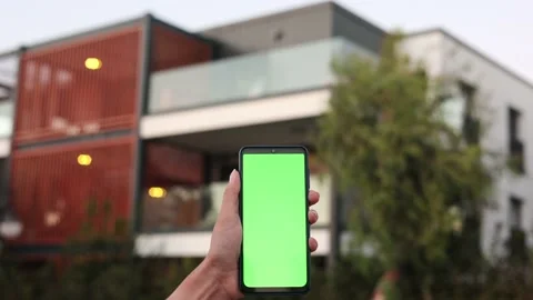 Smart home, smart house, application on the mobile phone. Hand holds smartphone 스톡 동영상 213280816