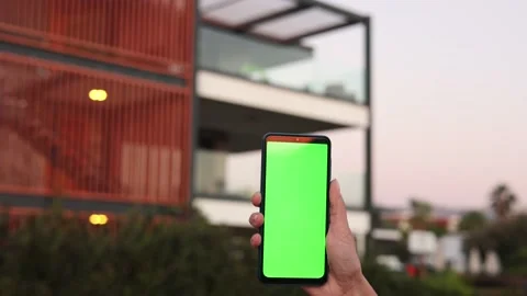 Smart home, smart house, application on the mobile phone. Hand holds smartphone Stock Footage 220630803