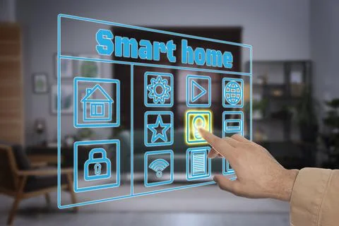 Smart home system. Man using digital interface in room, closeup Stock Photos