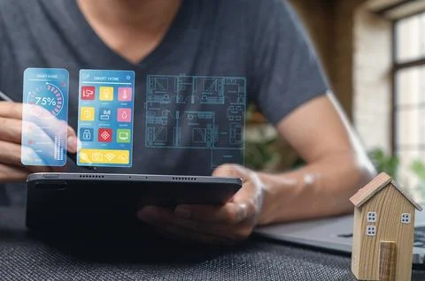 Smart Home Technology Interface with Digital Tablet and House Model Stock Photos