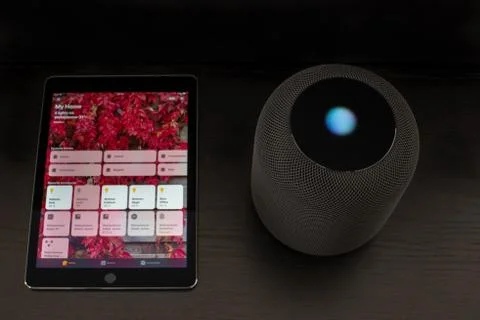 Smart home using an Apple HomePod speaker and the home app on the iPad Stock Photos