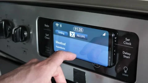 Smart Home Using The Display on an Oven Appliance Stock Footage 154429665