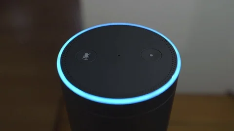 Smart Home Voice Controlled Gadget Turning On And Off Smart Light Bulb Video stock 75487136