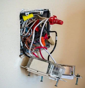 Smart home in-wall dimmer replacement wiring and installation Stock Photos