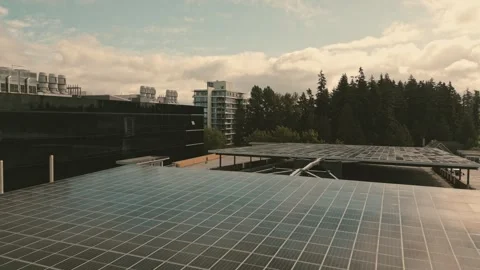 Smart hydrogen facility solar array collecting sunlight filmed low altitude Stock Footage 334513112