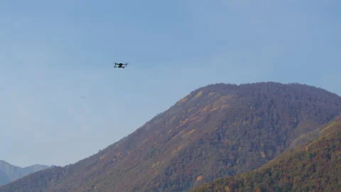 Smart innovation drone fly on mountains to help peopleal technology, slow motion Stock Footage 206850816