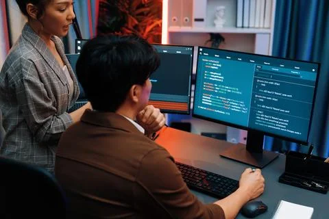 Smart IT developer looking at coding program application at back side. Infobahn. Stock Photos