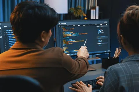 Smart IT developer looking at coding program application at back side. Infobahn. Foto stock