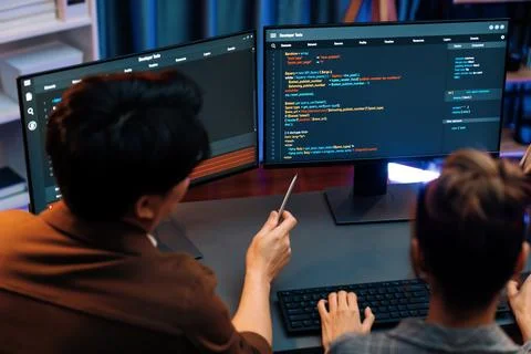 Smart IT developer looking at coding program application at back side. Infobahn. 스톡 사진