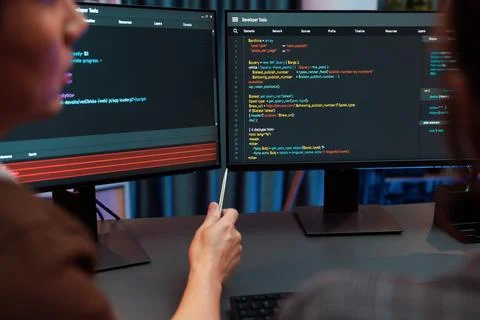 Smart IT developer looking at coding program application at back side. Infobahn. Foto stock