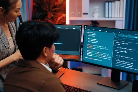 Smart IT developer looking at coding program application at back side. Infobahn. Stock Photos