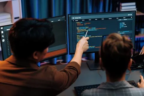 Smart IT developer looking at coding program application at back side. Infobahn. 写真素材