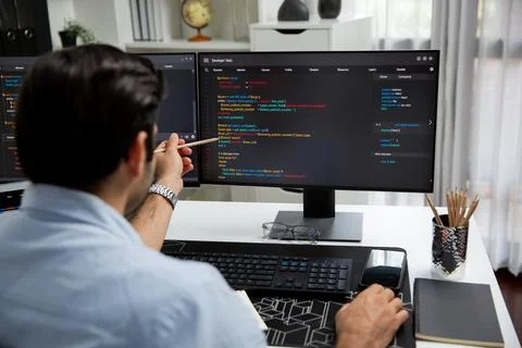 Smart IT developer pointing data software development lines on pc. Surmise. Stockfoto's