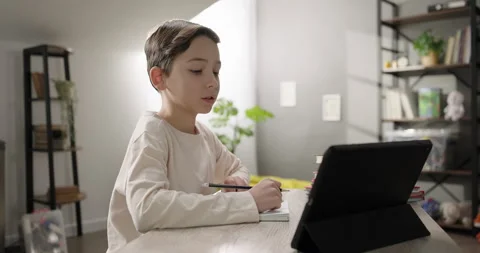 Smart kid boy talking to webcam learning online, conference call video chat with Stock Footage 274362526